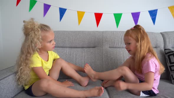 Two Little Girls Sharing Secrets to Each Other While Enjoying Time Together