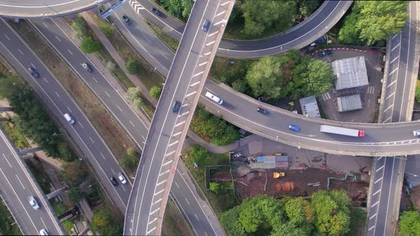 Vehicles Driving on a Spaghetti Interchange Aerial View alt