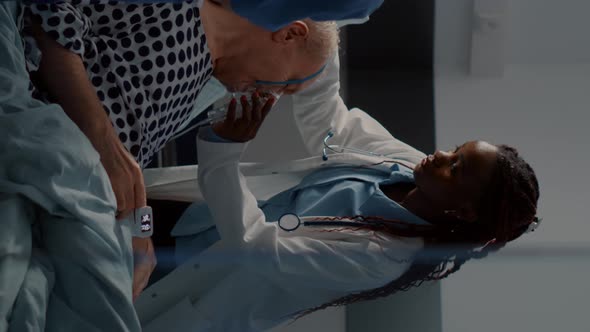 Vertical Video Patient with Breathing Problems in Hospital Ward Bed alt