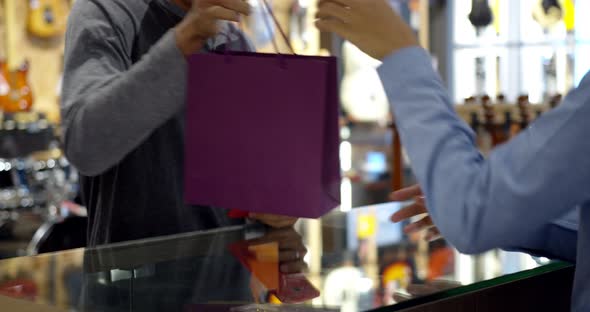 Young muslim man use smartphone paying over contactless transaction machine alt