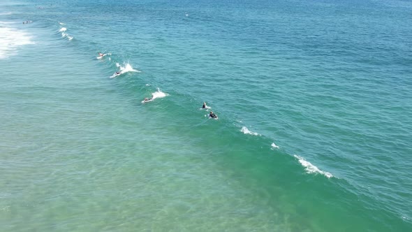 A Surfer Catches A Wave