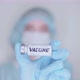 The doctor holds the vaccine in his hand in an ampoule - VideoHive Item for Sale