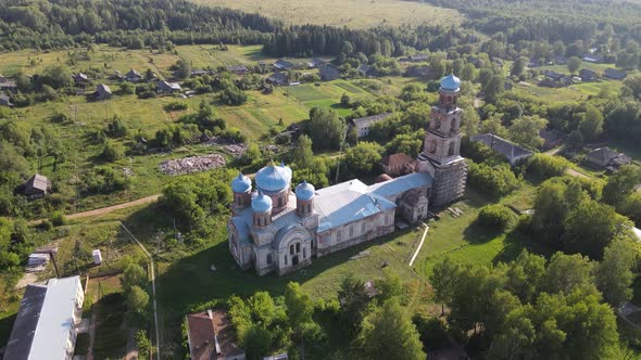Fly Around Old Historical Church with Domes in Countryside