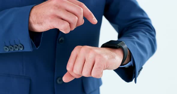 Mid section of businessman using smartwatch 4k alt