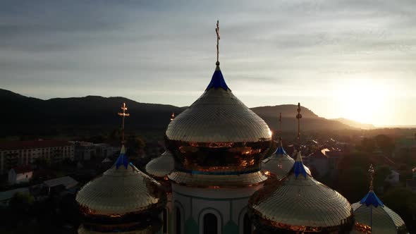 Golden Church Cross on Against Sunset Aerial View Majestic Temple in Ukraine alt