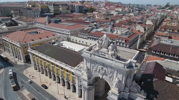 aerial footage of Augusta Arch in Lisbon, Portugal alt