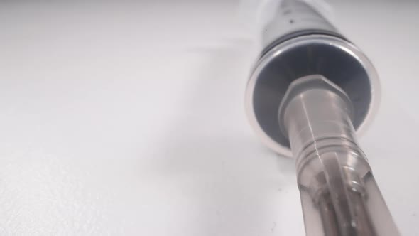 New Syringe with Open Needle on White Background Macro alt