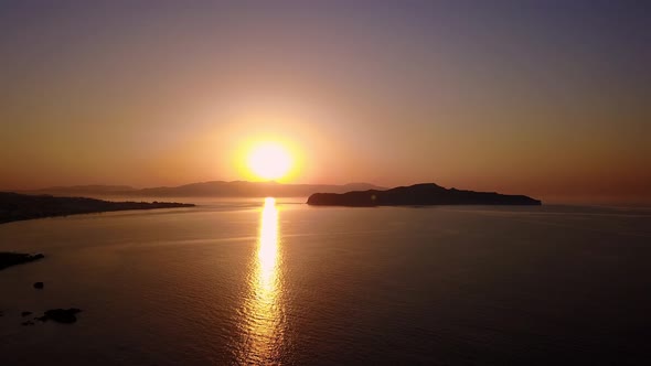 Aerial View of a the Mediterranean Sea in Golden Sunlight  Flying Towards the Sun