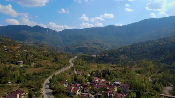 steep green mountains, deep forest and mountain road, beautiful valley   alt