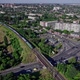 Drone Rises Above the Intersection of the Roads in a Suburb - VideoHive Item for Sale