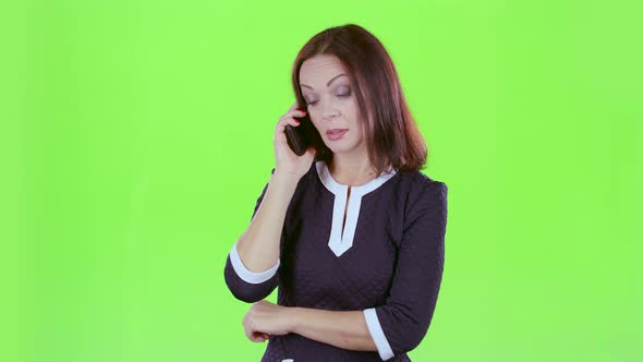 Lady Is Talking on the Phone with Her Daughters, Green Screen alt