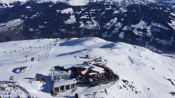 Snowy Mountain Hut in Tirol Region in Austrian Alps Hochfugen Drone Flyover the Mountains and