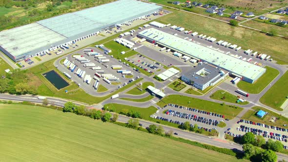 Aerial view of warehouse storages or industrial factory or logistics center from above. Top view of alt