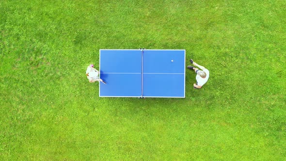 Aerial view people playing ping pong match outdoor