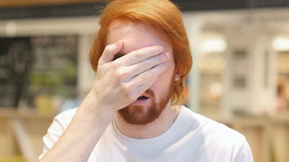 Wondering Redhead Man at Work, Hiding Eyes in Shock alt