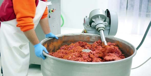 Mixing Mince Meat With Spices alt
