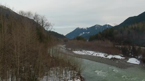 Aerial View of Chilliwack River with Snow During Winter Season alt