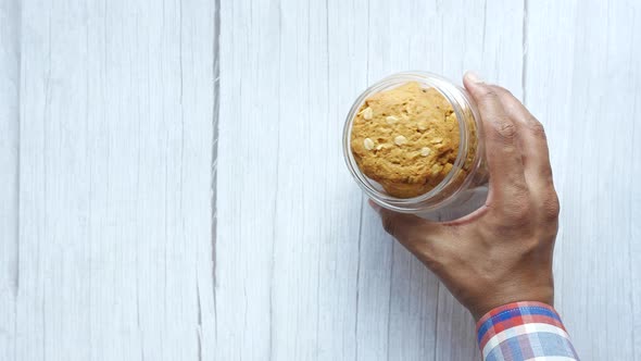 Hand Pick Oat Cookies From a Jar alt
