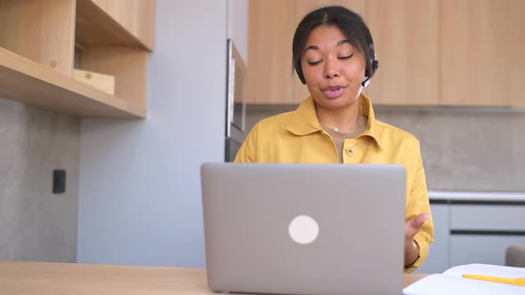 Saleswoman Taking a Call While Working Remotely From Home Office