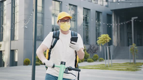 Bicycle Courier Using a Smartphone Talking to a Customer Delivering Food alt