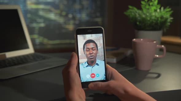 Video Calling with Black Man on Smartphone