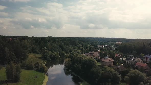 Aerial Panoramic Video Above Countryside Lanscape With Farmhouses On River