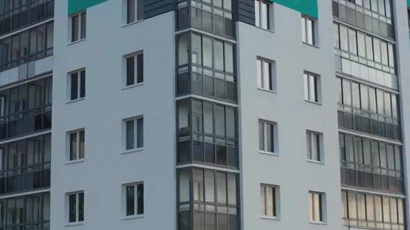 Aerial View of a Residential Building Against the Backdrop of an Urban Landscape alt