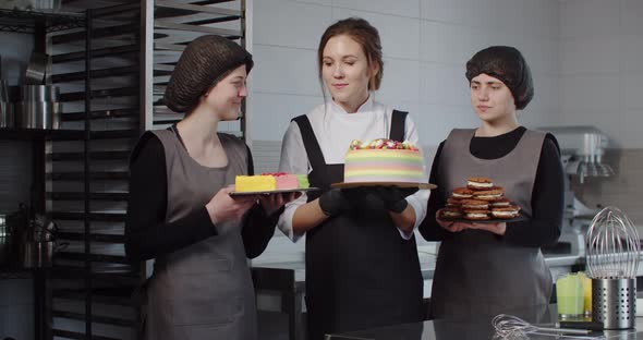 The Confectioner and His Assistants Present a Variety of Sweet Desserts alt