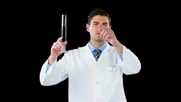Doctor using digital screen while examining chemical in test tube alt