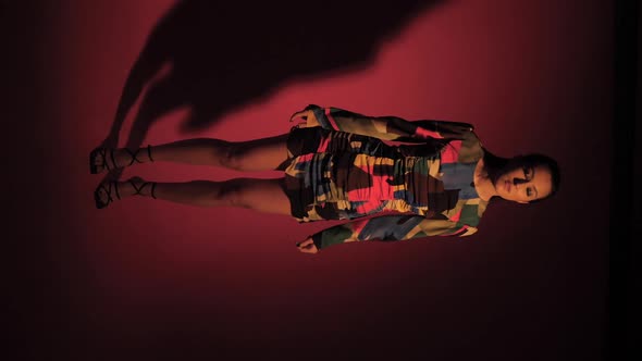 Fashionable Sexy Woman Model of Asian Appearance in a Business Pink Suit alt