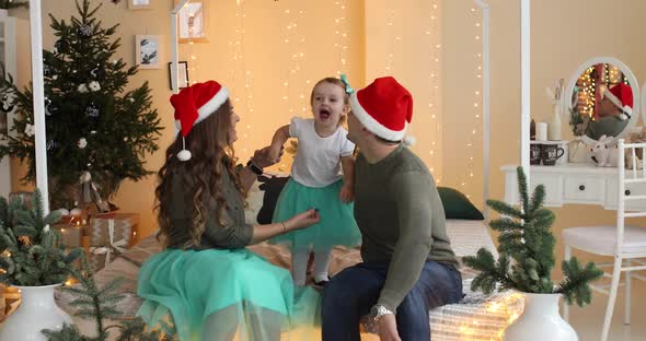 Family in Santa Hats at Home.