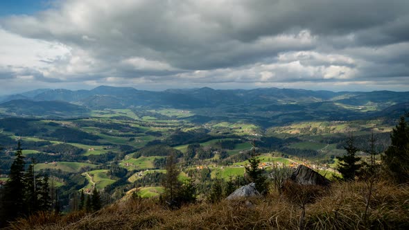 Timelapse Clouds Fly Over a Valley in the Mountain