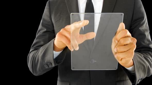 Businessman holding and touching a glass screen