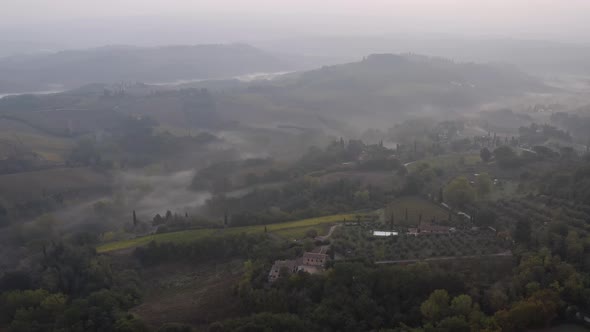 Italy. Tuscany. Early Sunny morning. Thick fog over fields