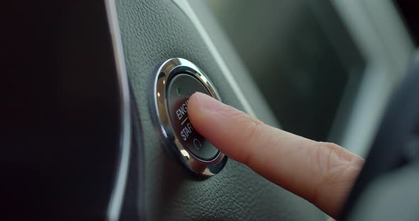 Pushing Power Ignition Button To Start Keyless Ignition Hybrid Car Engine. alt