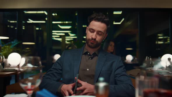 Handsome Guy Paying Restaurant Dinner Using Credit Card on Evening Romantic Date alt