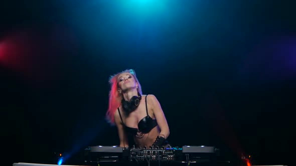 Blonde DJ Woman Sexy Dancing for Mixing Console alt
