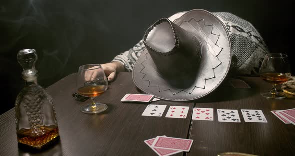 Passed out cowboy at the poker table in the bar, whiskey, guns and cards, 4k alt