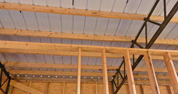 In a Metal Frame Warehouse the Roof is Covered with Panels of Roofing That are Made of Metal alt