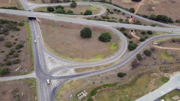 Aerial View of Vehicles Traveling Along Highway