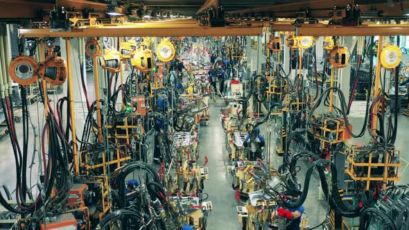 Car Body Parts Welding Process at a Modern Car Manufacturing Facility alt