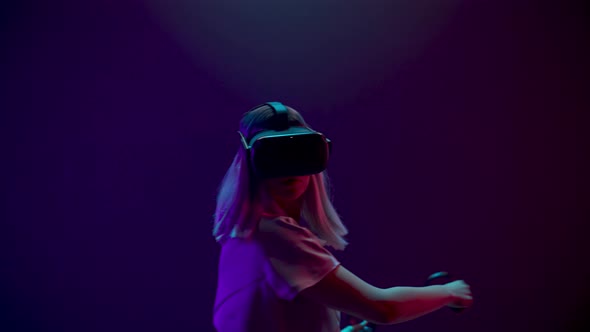 Gamer Playing Virtual Reality Game Using Invisible Swords alt