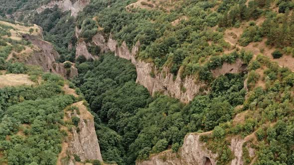Aerial Drone Flying Over Hills and Green Forests in Armenia alt
