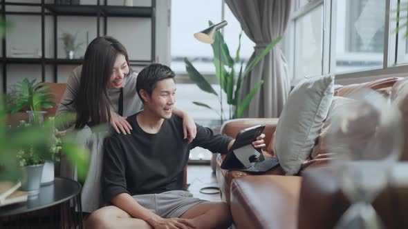 asian marry couple wear casual cloth home isolate quarantine enjoy watching online movie alt