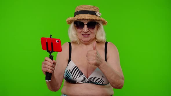 Senior Pensioner Woman Tourist Taking Selfie Portrait Photo Making Video Call on Mobile Phone alt