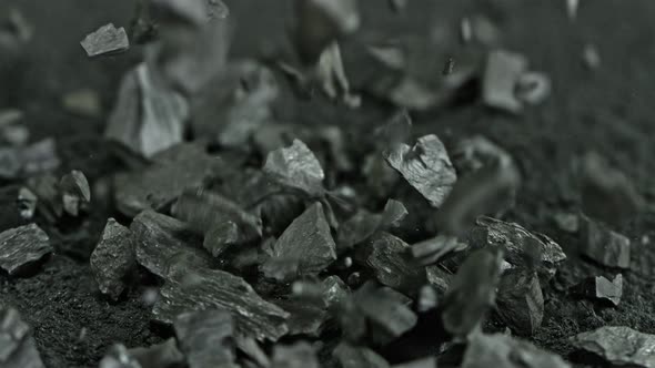 Super Slow Motion Shot of Falling and Crashing Coal at 1000 Fps alt