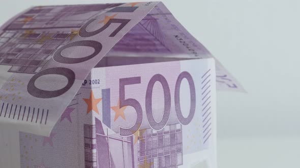 Tilting on real estate with 500 Euro denominations 4K 21650p 30fps UltraHD footage - House made meta alt