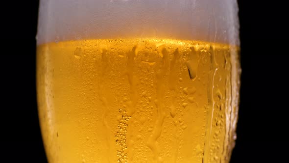Beer Glass with Falling Water Drops