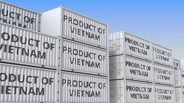 Containers with PRODUCT OF VIETNAM Text in a Container Terminal alt