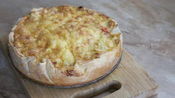 Baked meat pie. Delicious cake is ready. Meat pie is on the table. alt